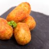croquettes on gray slate plate. selective focus. copy space